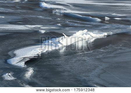 The river is  frozen hard in cold winter