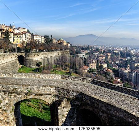 Ruins of old bridge at old town Cita Alta of Bergamo town in Italy