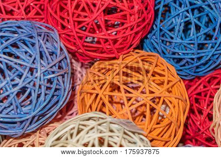 Decorative spheres made of straw and painted in different bright colors