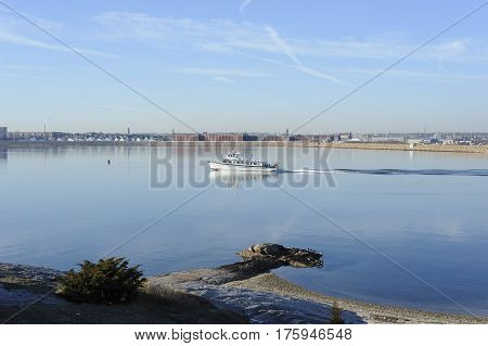 Fairhaven Massachusetts USA - January 16 2017: Ferry to Cuttyhunk Island picks up speed on the Acushnet River as it leaves New Bedford