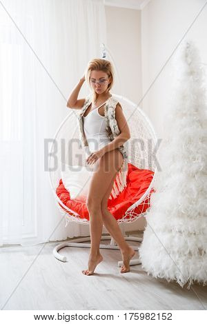 Beautiful girl sexy blonde in lingerie posing in the bathroom