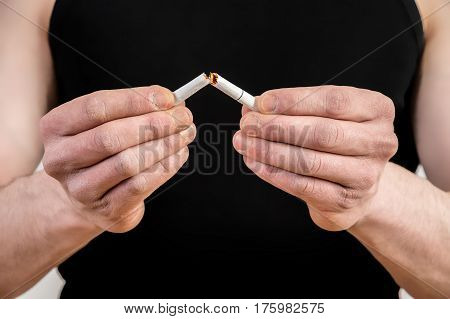 Quit smoking - male hand crushing cigarette