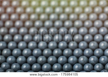 Blurred Background Of Grey Airsoft Balls Of 6Mm