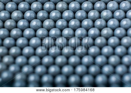 Blurred Background Of Grey Airsoft Balls Of 6Mm