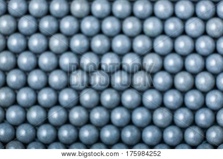 Blurred Background Of Grey Airsoft Balls Of 6Mm