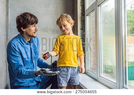 Father And Son Repair Windows Together. Repair The House Yourself