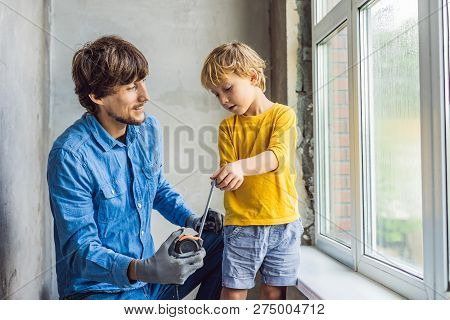 Father And Son Repair Windows Together. Repair The House Yourself