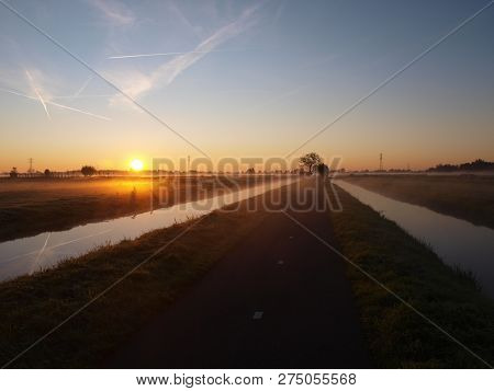 Sunrise With Morning Fog Over The Meadows Of The Polder At Goudarak Close To Gouda In The Netherland