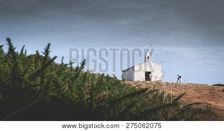 Tourists Visiting The Surroundings Of La Meule Chapel Near Island Of Yeu