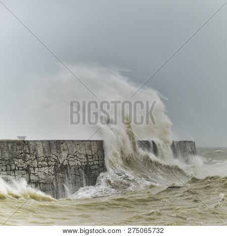 Stunning Waves Crashing Over Harbor Wall During Windy Storm At Newhaven On English Coast