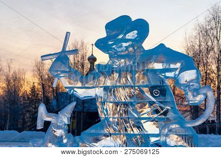Karabas-barabas. Ice Sculpture-evil Puppeteer Controls A Puppet On The Background Of A Religious Tem