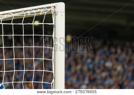 Goal Post With Soccer Fans In The Background