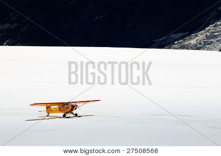 An airplane landing on Aletsch Glacier, Berner Oberland, Switzerland