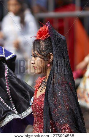 Oruro, Bolivia - February 25, 2017: Members Of A Waca Waca Dance Group In Ornate Costume Parade Thro