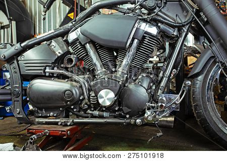 Cropped Close Up Shot Of Beautiful And Custom Made Motorcycle In The Workshop