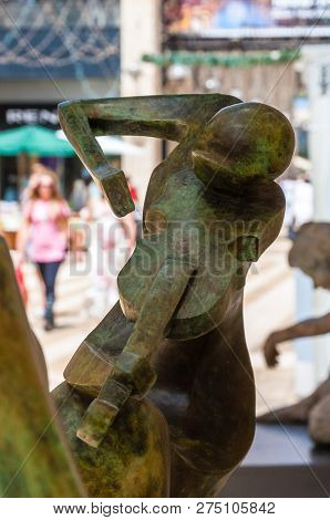 Jerusalem, Israel - May 25, 2012: View On Mamilla Road Through Street Art Bronze Sculpture Of Woman 