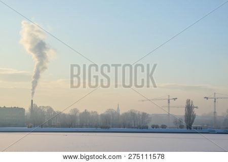 Riga View In Winter; Riga, Capital City Of Latvia In Winter Time. View Of Riga With Frozen River Dau