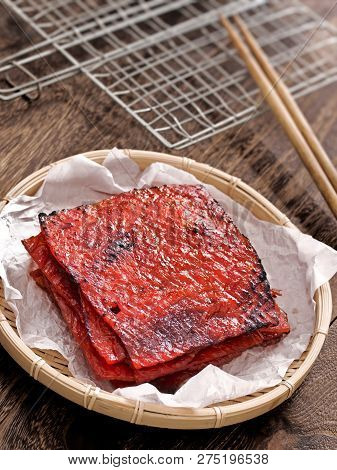 Close Up Of A Basket Of Chinese Pork Jerky