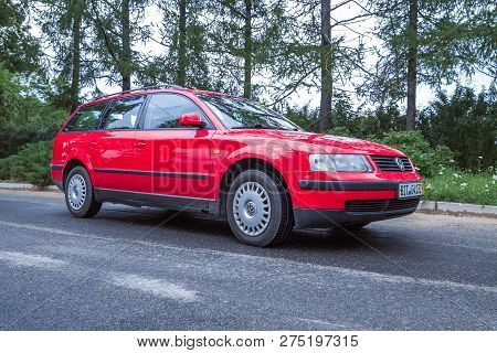 Red Wolksvagen Passat B5 To Street, Trees An Way. Travel Photo 2012.