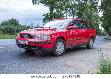 Red Wolksvagen Passat B5 To Street, Trees An Way. Travel Photo 2012.