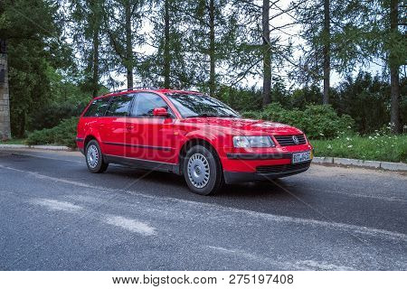 Red Wolksvagen Passat B5 To Street, Trees An Way. Travel Photo 2012.
