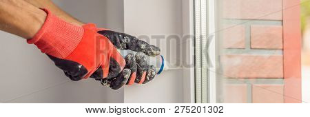Man In A Blue Shirt Does Window Installation Banner, Long Format