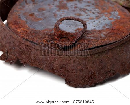 Part Of Old Rusty Tin Can. Isolated On White Background. Close-up View.