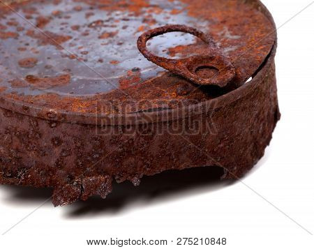 Part Of Old Old Rusty Tincan. Isolated On White Background. Close-up View.