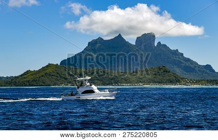 French Polynesia, Papeete, December, 29, 2017 - A Small White Boat Returns From Fishing To The Bora-