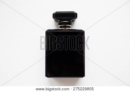 Close-up Of Black Perfume Bottle, Isolated On White.