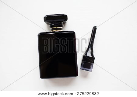 Close-up Of Black Perfume Bottle, Isolated On White.