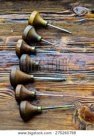 Different Gravers For Jewelry On A Wooden Background
