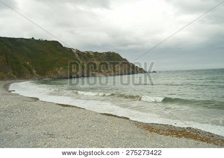 Beautiful Cliffs And Shore Of Stones In The Beach Of The Mills In Barcia. July 30, 2015. Beach Of Lo