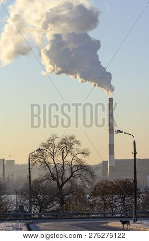 Smoke From Industrial Chimneys Against The Blue Sky. Pollution.
