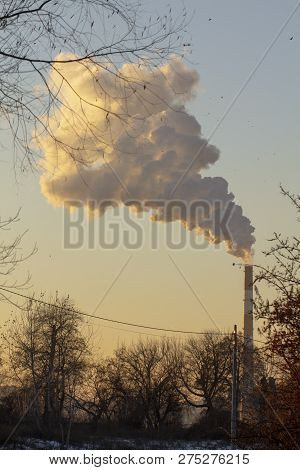 Smoke From Industrial Chimneys Against The Blue Sky. Pollution.