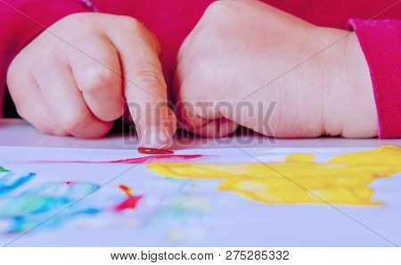 Art, Creativity, Beauty Childhood Concept. Little Cute Child Girl Painting With Inger.