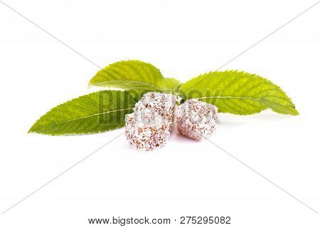 Slices Of Delicacy Turkish Delight With Coconut Chips And Mint Leaves Isolated On White Background