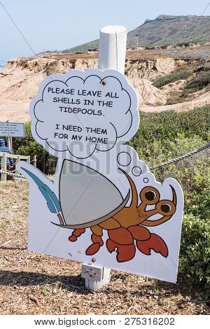 May 10 2017 - San Diego, California: A Sign Showing A Cartoon Crab Tells Visitors Not To Steal Wildl