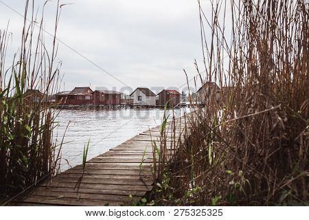 Wooden Bridges On The Lake Bokod. Fishing Wooden Cottages, Hungary