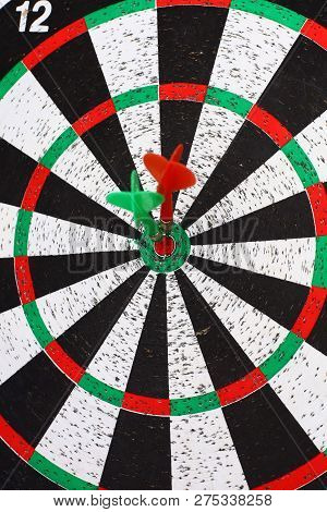 Closeup. Several Arrows Dart Hitting The Center Of The Target D