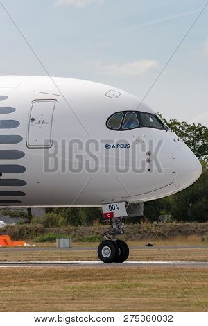 Farnborough, Uk - July 18, 2014: Airbus A350-941 Commercial Aircraft With A Hybrid Airbus/qatar Airw