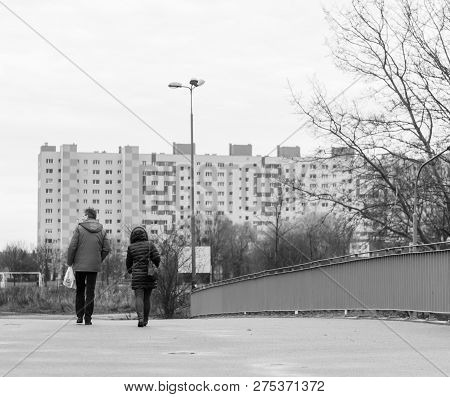 Poznan, Poland - December 2, 2018: Couple Walking On A Bridge On The Orla Bialego District With Apar