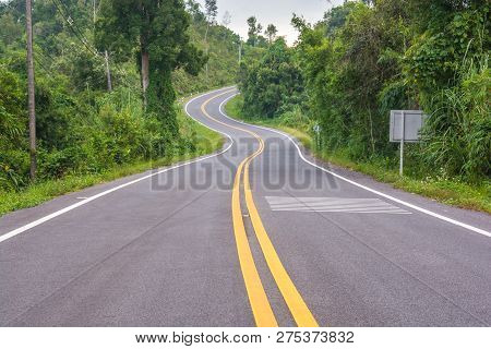 Asphalt Road In Countryside On Sunny Summer Day
