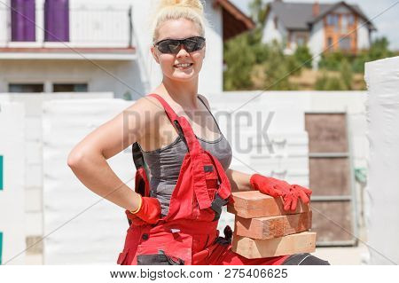 Woman Working With Bricks