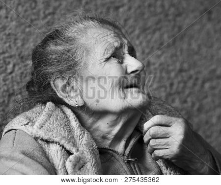 Very Old And Tired Wrinkled Woman Outdoors