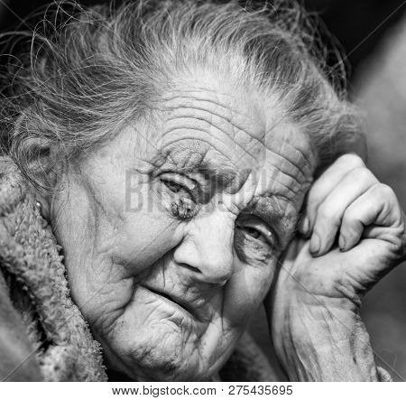 Very Old And Tired Wrinkled Woman Outdoors