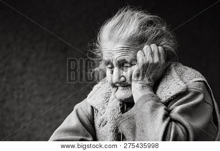 Very Old And Tired Wrinkled Woman Outdoors