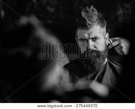 Reflexion Of Barbers Hand With Hair Clipper Trimming Nape Of Client. Hipster Bearded Client Getting 