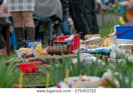 Tocuz, Moldova- 16 April, 2018: Goods On The Graves In The Cemetery Celebrating The Dead During Memo