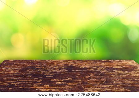 Selective Focus Of Empty Old Wood On Blur Nature Green Leaf With Bokeh.